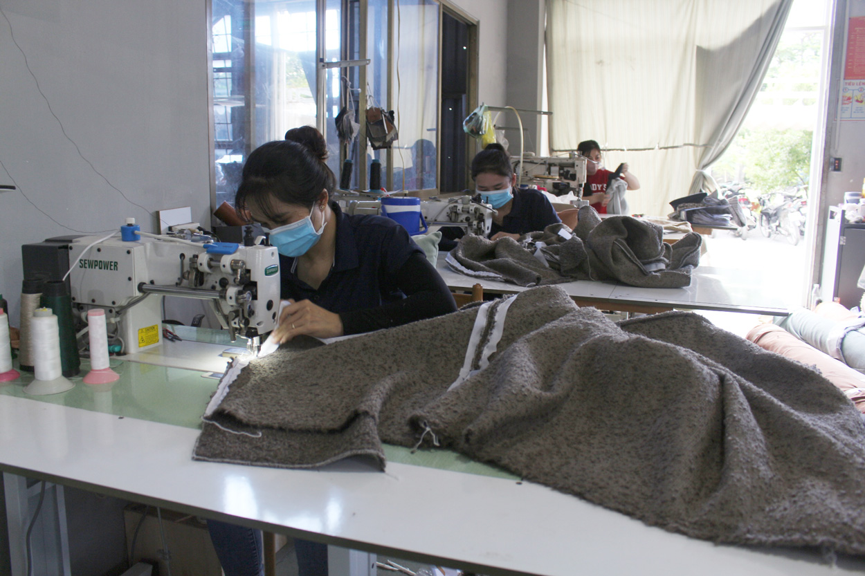 Furniture supplier checklist - workers sewing furniture covers during a social compliance audit