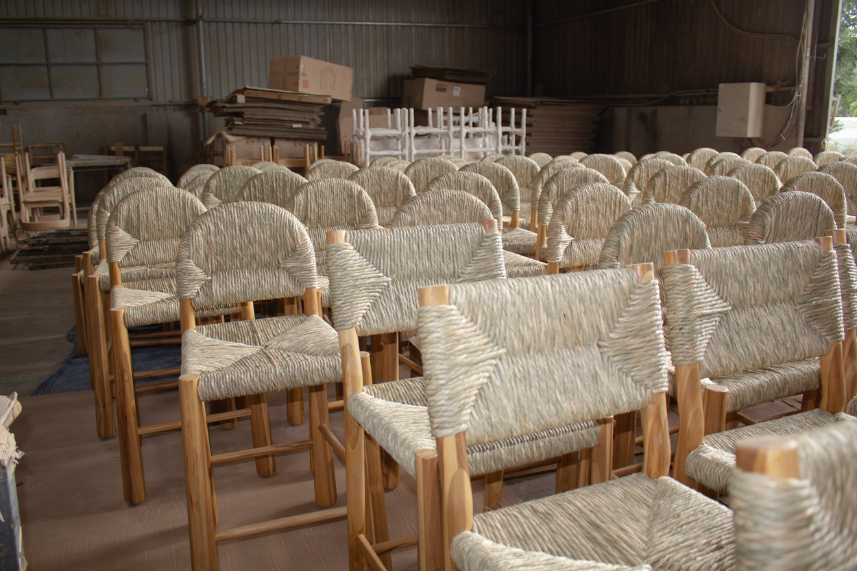 Completed custom wood outdoor furniture pieces at Aurora Craft’s workshop, awaiting quality inspection and packaging before shipment.