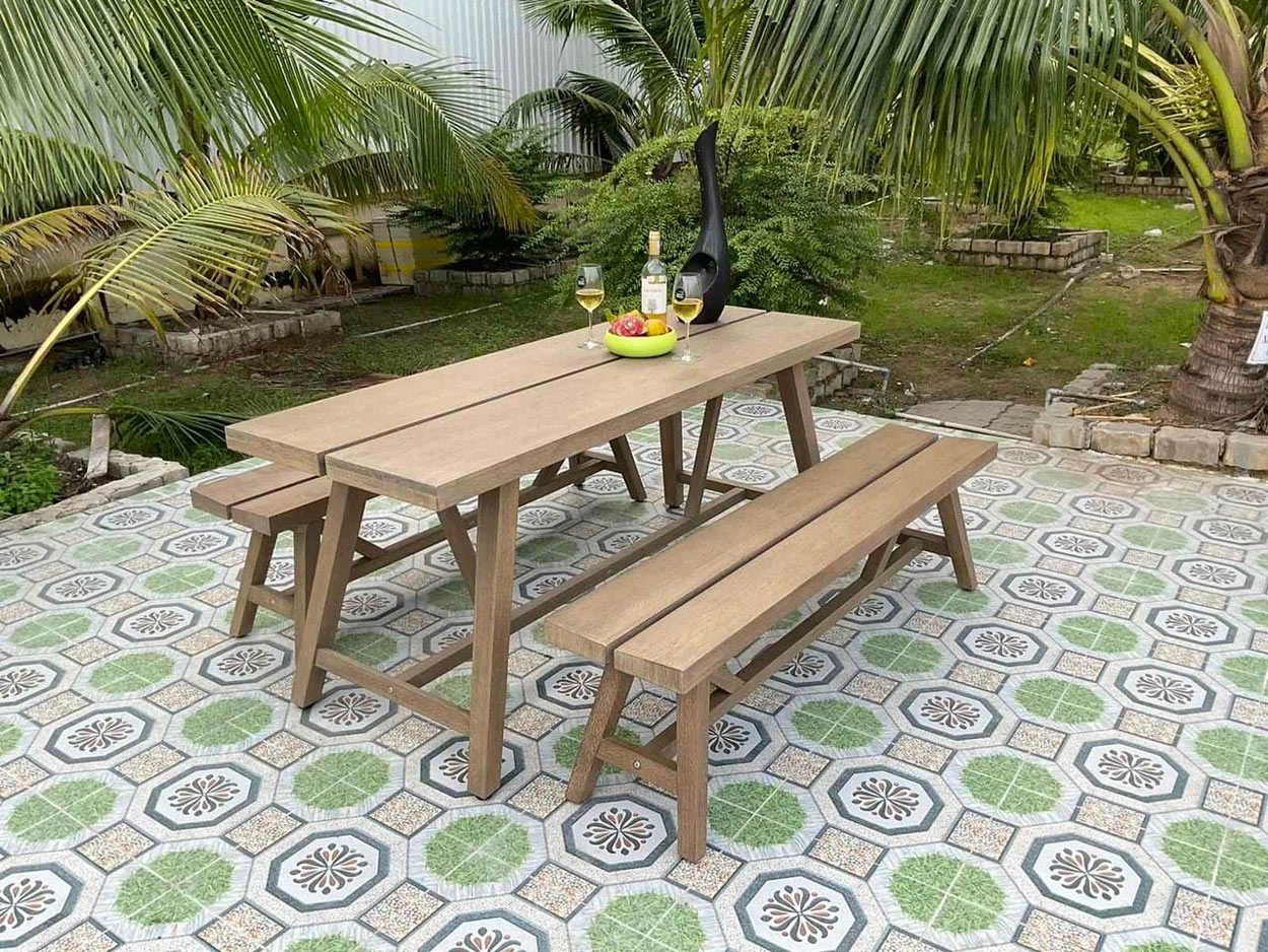Eucalyptus wood outdoor furniture set with a garden table and benches, showcasing durable wood for outdoor furniture in a patio setting.