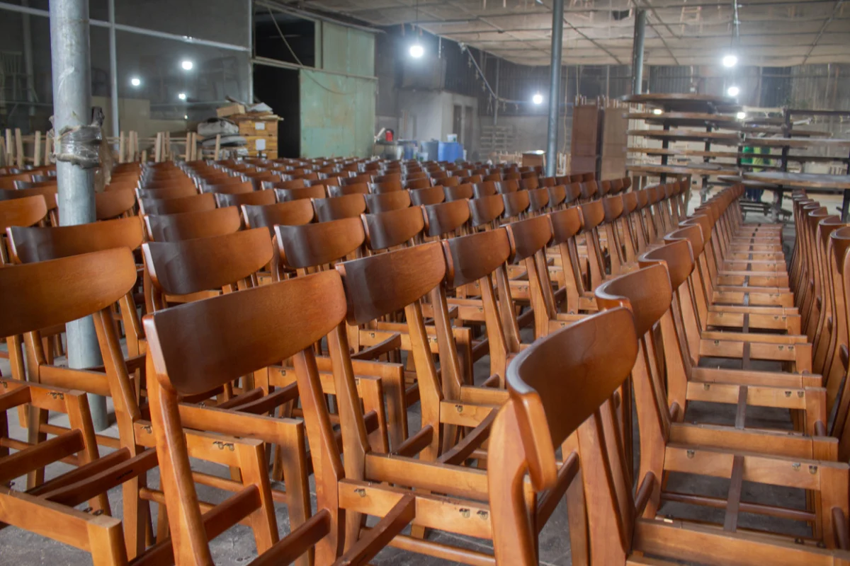 Hotel furniture wholesale production showing large-batch chair manufacturing and the importance of production capacity and quality control