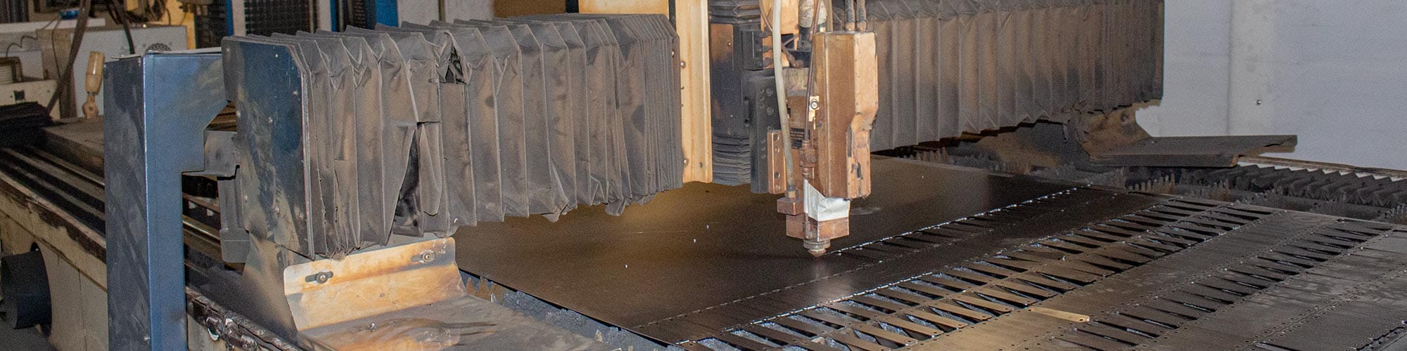 CNC laser cutting process in metal furniture manufacturing demonstrating advanced fabrication capabilities and precision